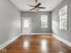 Bright bedroom features polished hardwood floors, ample natural light, and neutral paint scheme at 914 English Ave, Indianapolis, IN 46203