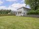 Charming two-story home with a covered porch, large yard, and picket fence at 914 English Ave, Indianapolis, IN 46203