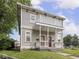 Charming two-story duplex featuring a shared front porch, classic architecture, and well-maintained landscaping at 914 English Ave, Indianapolis, IN 46203