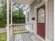 Charming entryway featuring a covered porch, decorative door with glass, and cozy outdoor space at 914 English Ave, Indianapolis, IN 46203