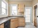 Kitchen featuring tile flooring, neutral counters and an exterior door at 914 English Ave, Indianapolis, IN 46203