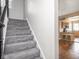 Elegant staircase leading to upper floors, complemented by an open view into the kitchen area at 914 English Ave, Indianapolis, IN 46203