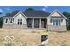 Charming one-story home featuring stone accents, a covered porch, and stylish architectural details at 9437 Dogwood Dr, McCordsville, IN 46055