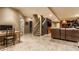 Finished basement with a recreation area, study space, and cozy seating for relaxation at 9804 Wentworth Ct, Carmel, IN 46032