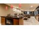 Enjoy this basement with a bar area, comfortable seating, and stylish accents for entertaining at 9804 Wentworth Ct, Carmel, IN 46032