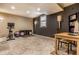 Finished basement featuring a workout area, tile flooring, and neutral wall colors at 9804 Wentworth Ct, Carmel, IN 46032