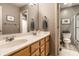 Well-lit bathroom features double sinks, a large mirror, and a separate toilet/shower area at 9804 Wentworth Ct, Carmel, IN 46032