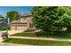 Charming brick home with a three car garage and beautiful landscaping at 9804 Wentworth Ct, Carmel, IN 46032