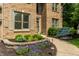 Beautiful brick home with well manicured front yard and stone walkway at 9804 Wentworth Ct, Carmel, IN 46032