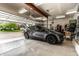Spacious two car garage featuring an EV charger and plenty of storage space at 9804 Wentworth Ct, Carmel, IN 46032