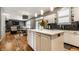 Eat-in kitchen featuring a center island with bar seating and stylish countertops at 9804 Wentworth Ct, Carmel, IN 46032