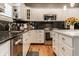 Well-appointed kitchen boasting modern appliances and sleek countertops at 9804 Wentworth Ct, Carmel, IN 46032