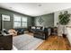 Inviting living room featuring a comfortable sectional sofa, area rug, and ample natural light at 9804 Wentworth Ct, Carmel, IN 46032