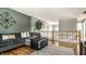 Spacious loft area with hardwood floors, offering a versatile living space for relaxation at 9804 Wentworth Ct, Carmel, IN 46032