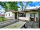 Close up of the wooden back deck with picnic table, metal pergola, with view to the house at 101 Heiny Rd, Indianapolis, IN 46217