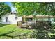 Wooden deck off the house, featuring stairs down to the yard and metal pergola feature at 101 Heiny Rd, Indianapolis, IN 46217