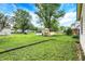 The spacious backyard features a storage shed, green grass, and plenty of room to relax and play at 101 Heiny Rd, Indianapolis, IN 46217
