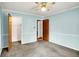 A light blue bedroom features a closet and a ceiling fan at 101 Heiny Rd, Indianapolis, IN 46217