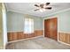 A cozy bedroom featuring a ceiling fan, natural light, and a closet for convenient storage at 101 Heiny Rd, Indianapolis, IN 46217