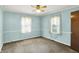 A bedroom features blue walls and a ceiling fan at 101 Heiny Rd, Indianapolis, IN 46217
