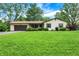 Lovely single-Gathering home featuring a well-maintained lawn, mature trees, a spacious driveway, and an attached garage at 101 Heiny Rd, Indianapolis, IN 46217