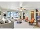 Staged living room with a ceiling fan, natural light, and view to the kitchen at 101 Heiny Rd, Indianapolis, IN 46217