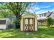 Image of a charming shed in the backyard with a unique design and a well-kept lawn and garden at 101 Heiny Rd, Indianapolis, IN 46217