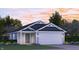 Charming single-Gathering home boasting craftsman-style architecture, a two-car garage, and manicured landscaping at 1073 Fuller Ln, Shelbyville, IN 46176