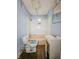 This bathroom has blue walls, a pink tub, toilet and sink at 1140 Mcdougal St, Indianapolis, IN 46203