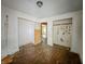 This bedroom has peeling paint, worn wood floors, and closet at 1140 Mcdougal St, Indianapolis, IN 46203