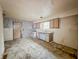 Dated kitchen with laminate floors, vintage cabinets and a water heater at 1140 Mcdougal St, Indianapolis, IN 46203