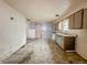 Dated kitchen features laminate floors, vintage cabinets and a sink with a view at 1140 Mcdougal St, Indianapolis, IN 46203