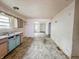 Dated kitchen with blue cabinets and a view to the living room at 1140 Mcdougal St, Indianapolis, IN 46203