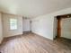 Bright living room featuring wood floors, a window and textured walls at 1140 Mcdougal St, Indianapolis, IN 46203