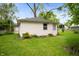 A well-maintained backyard with a white vinyl shed and a green, grassy lawn at 1212 Woodlawn Ave, Indianapolis, IN 46203