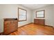 This bedroom boasts hardwood floors, two windows, and is ready for personal touches at 1212 Woodlawn Ave, Indianapolis, IN 46203
