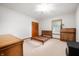 Light-filled bedroom with carpet, simple furnishings, and a large closet at 1212 Woodlawn Ave, Indianapolis, IN 46203