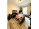 Cozy bedroom featuring a wooden bed frame, area rug and bright natural light at 125 W Church St, Thorntown, IN 46071