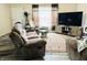 Cozy living room with comfortable seating, wood-look floors, and a neutral color palette at 125 W Church St, Thorntown, IN 46071