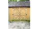 Wooden shed featuring double doors with a rustic design and a secure latch at 125 W Church St, Thorntown, IN 46071