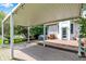 Wide view of the covered deck, beautiful yard, and access to the house at 1410 Shadow Ct, Zionsville, IN 46077