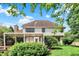 Lush backyard featuring a spacious deck, shade trees, and a well-maintained lawn at 1410 Shadow Ct, Zionsville, IN 46077