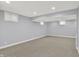 A spacious basement features recessed lighting, neutral carpeting and windows to provide natural light at 1410 Shadow Ct, Zionsville, IN 46077