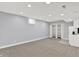 This finished basement offers carpeting, recessed lighting, and a small kitchenette for added convenience at 1410 Shadow Ct, Zionsville, IN 46077
