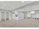 Open basement with carpet, built-in shelves, closet and refrigerator with room to entertain Gathering and friends at 1410 Shadow Ct, Zionsville, IN 46077