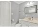 Updated bathroom with a vanity, toilet, and a shower with a glass door, featuring neutral finishes at 1410 Shadow Ct, Zionsville, IN 46077