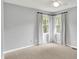 Bedroom with neutral walls, carpet and windows showing outdoor view at 1410 Shadow Ct, Zionsville, IN 46077