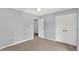 Bedroom with neutral walls, carpet, ceiling fan and closet doors at 1410 Shadow Ct, Zionsville, IN 46077