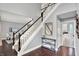 Foyer with hardwood floors, staircase, runner, and decorative accents at 1410 Shadow Ct, Zionsville, IN 46077