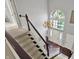 Grand foyer with a staircase and a large window above the front door at 1410 Shadow Ct, Zionsville, IN 46077